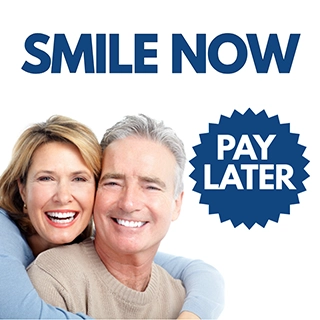 Smiling couple after successful dental treatment