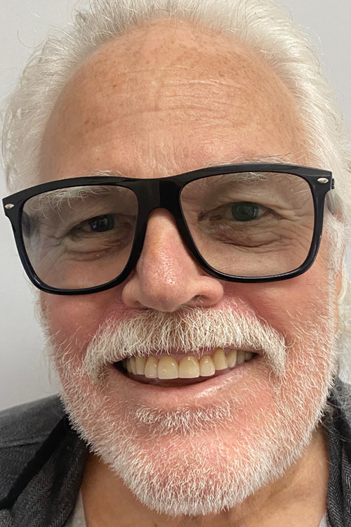 Portrait of a Balboa Dentistry patient smiling after treatment.
